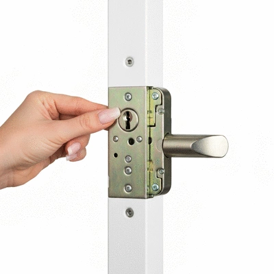 Hand adjusting a modern door lock, demonstrating maintenance